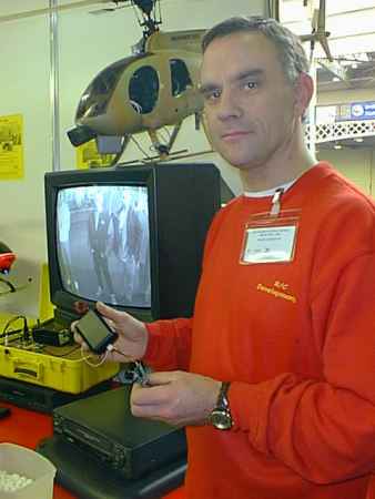 Graham Smith of Radio Controlled Developments shows Heli Cam video transmitter/receiver. The monitor shows the view from the nose of the helicopter.