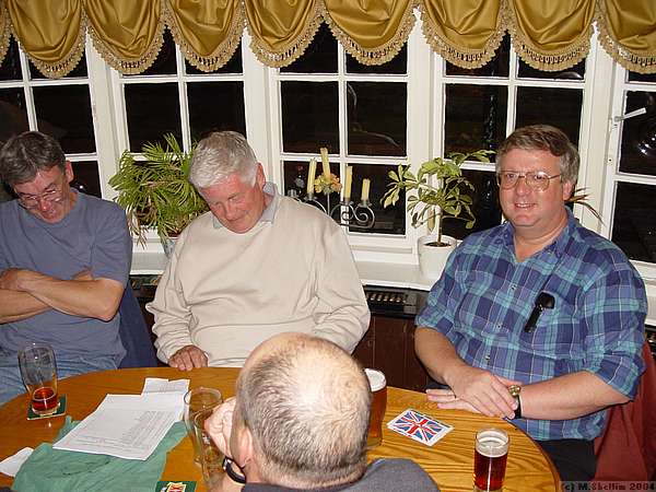 Mark Freeman, Tom MacPherson, the back of Mark Southall's head, and John Bennett