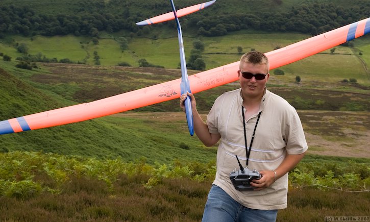 Graham Reed and X21. Graham is the sole 2.4 GHz user on the F3F circus and therefore has more experience than anyone re glider applications. He has a Skorpi with a glass fuz on order to avoid shielding issues with carbon.