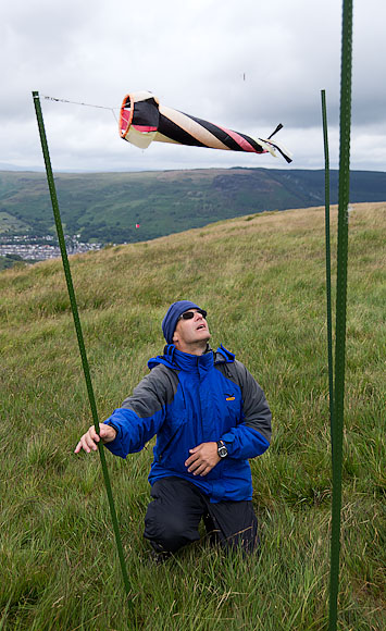 Mark Redsell keeps a watchful eye on the wind sock. The poles indicate 45 degree limits.
